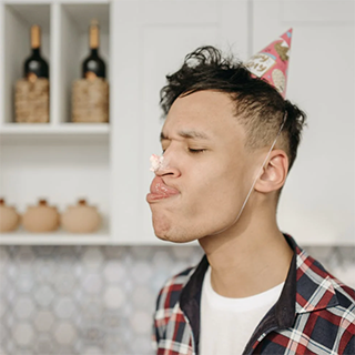 Funny picture of a guy with a birthday hat on