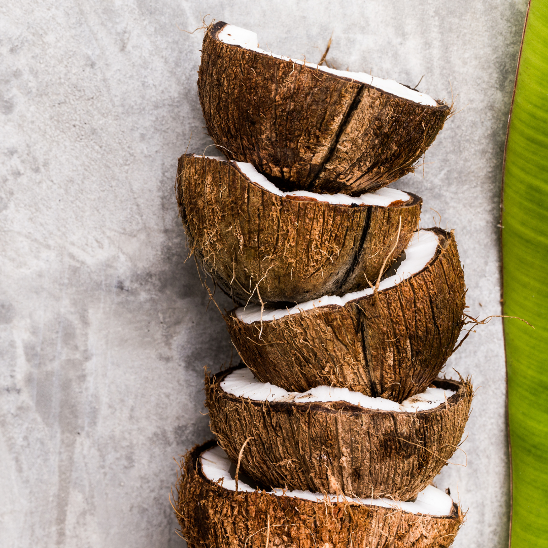 halved coconuts in a stack